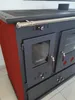 A close-up view of a red and gray wood-burning stove. Náhled obrázku produktu