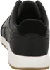 A close-up view of the back of a black sneaker with a white sole. Produktbild-Vorschau