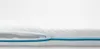 A close-up view of a white mattress with a blue zipper detail. Anteprima dell’immagine prodotto