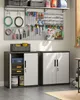 A well-organized garage or workshop with storage cabinets and tools displayed on a pegboard. Produktbild-Vorschau