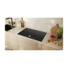 A modern kitchen countertop with an induction hob, sink, and various kitchen items. Podgląd zdjęcia produktu
