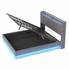 A modern gray upholstered bed frame with the storage mechanism open, revealing the storage space underneath. Blue LED lighting is visible around the base and headboard. Produktbild-Vorschau