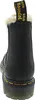 A rear view of a black Dr. Martens boot with a yellow stitch detail and a black pull tab with white text. Produktbild-Vorschau