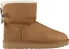 A side view of a single brown Ugg boot with a bow on the back. Produktbild-Vorschau