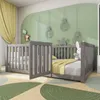 A child's bedroom with a gray wooden crib and a yellow blanket. Podgląd zdjęcia produktu