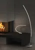 Two modern LED lamps are displayed in a living room setting next to a fireplace. Náhled obrázku produktu
