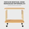A disassembled wooden side table with wheels, showing its components and assembly instructions. Produktbild-Vorschau