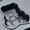 A close-up view of a teddy bear-shaped baking mold. Podgląd zdjęcia produktu