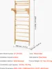 A wooden wall-mounted climbing frame with dimensions and specifications displayed. Produktbild-Vorschau