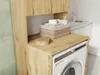 A laundry room with a washing machine and a cabinet. Anteprima dell’immagine prodotto
