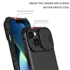 Close-up view of a black iPhone 14 case, highlighting its camera protection feature and raised edges for screen protection. Produktbild-Vorschau