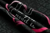 A close-up, folded view of a black microfiber bedsheet with pink heart designs and text. Produktbild-Vorschau