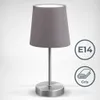 A close-up studio shot of a gray table lamp with a conical fabric shade and a metallic base and stem. Náhled obrázku produktu