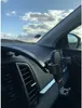 A car's dashboard with a phone holder attached. Anteprima dell’immagine prodotto