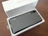 A Huawei P20 Pro smartphone is shown inside its white packaging box, resting on a wooden surface. Produktbild-Vorschau