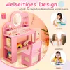 A pink children's vanity table and chair set with various accessories, surrounded by marketing graphics and text. Náhled obrázku produktu
