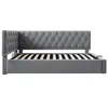 A side view of a gray upholstered bed frame with a tufted headboard and a slatted mattress support. Náhľad obrázku produktu