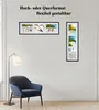 A living room scene with a chair, floor lamp, and two photo frames on the wall. Produktbild-Vorschau