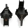 Two black motor brushes with copper connectors, shown from different angles against a white background. Produktbild-Vorschau