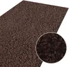 A close-up view of a dark brown shaggy rug, with a magnified inset showing the texture of the fibers. Náhled obrázku produktu