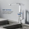 A modern chrome kitchen faucet is shown over a double sink with water running. Anteprima dell’immagine prodotto