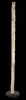 A tall, slender floor lamp made of a natural wood log with small lights attached along one side, standing on a black circular base. Produktbild-Vorschau