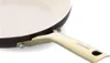 A close-up view of the handle and edge of a frying pan. Produktbild-Vorschau