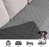 A dog is shown peeking over a quilted blanket that is placed on a sofa. Below the blanket are icons representing a dog cage, sofa, bed, and car. Náhled obrázku produktu