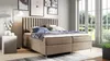 A bedroom scene with a large bed as the focal point, set against a backdrop of artwork and a large window with a garden view. Produktbild-Vorschau