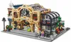 A LEGO model of a train station with people and accessories. Voir les images du produit