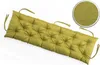 A tufted bench cushion in a lime green color, shown diagonally on a white background. A circular inset shows a close-up of the fabric texture. Produktbild-Vorschau
