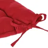 A close-up view of a red cushion with ties. Anteprima dell’immagine prodotto