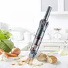 A cordless vacuum cleaner is shown cleaning up crumbs from a kitchen counter with vegetables and bread in the background. Produktbild-Vorschau