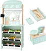 A wooden toy market stall with various accessories, including a cash register, scale, and toy produce, displayed against a white background. Produktbild-Vorschau
