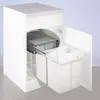 A white kitchen cabinet with a pull-out trash bin system, showing two white bins and a gray sliding mechanism. Anteprima dell’immagine prodotto