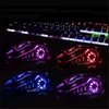 Four gaming mice with RGB lighting are displayed in front of a backlit keyboard in a dark setting. Produktbild-Vorschau