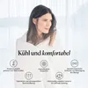A woman wrapped in a blanket, with marketing icons and text overlay. Produktbild-Vorschau