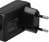 A close-up, angled view of a black power adapter with European-style prongs. Produktbild-Vorschau
