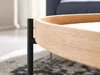 Close-up of a wooden table leg and edge. Voir les images du produit