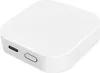 A white, square-shaped electronic device with rounded edges, showing a USB-C port and a button on its side. Produktbild-Vorschau