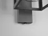 A close-up view of a modern outdoor wall light fixture mounted on a white wall. Anteprima dell’immagine prodotto