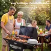 A family is enjoying a barbecue in a backyard setting. Anteprima dell’immagine prodotto