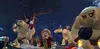 LEGO characters from The Hobbit are in a forest setting with large troll-like figures. Produktbild-Vorschau