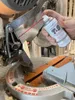 Boeshield T-9 can in hand and used to spray a tablesaw machine to prevent rust Náhľad obrázku produktu
