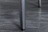 Close-up of a table leg on a wooden floor. Produktbild-Vorschau
