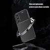 A black phone case with a textured pattern and a silver ring stand is shown against a dark, rocky background. Produktbild-Vorschau