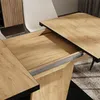 A close-up view of an extendable dining table with a wood-grain finish. Anteprima dell’immagine prodotto