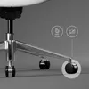 Close-up of the base and wheels of an office chair. Voir les images du produit