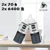 Two ink bottles are placed on a desk in front of a laptop and a glass of water, with a blurred office background. Produktbild-Vorschau