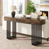 A console table with a wooden top and black metal legs is placed in a living room setting. Náhľad obrázku produktu